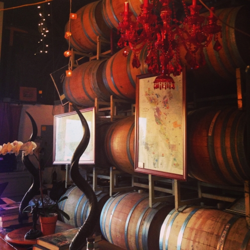 I loved the way the Jalama wines tasting room used the barrels to create art walls and added rustic elements like horns to compliment the red chandeliers.